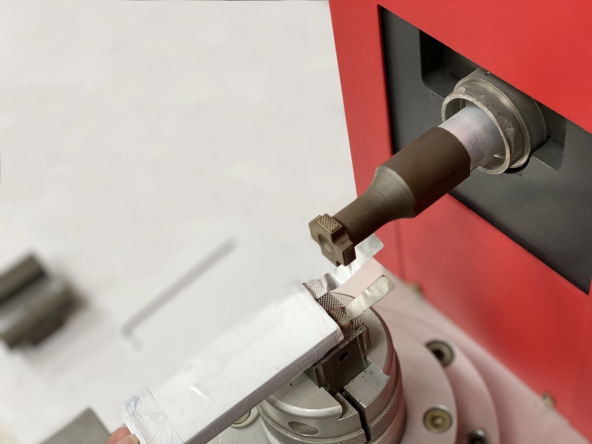 Technician checking an ultrasonic cutting blade